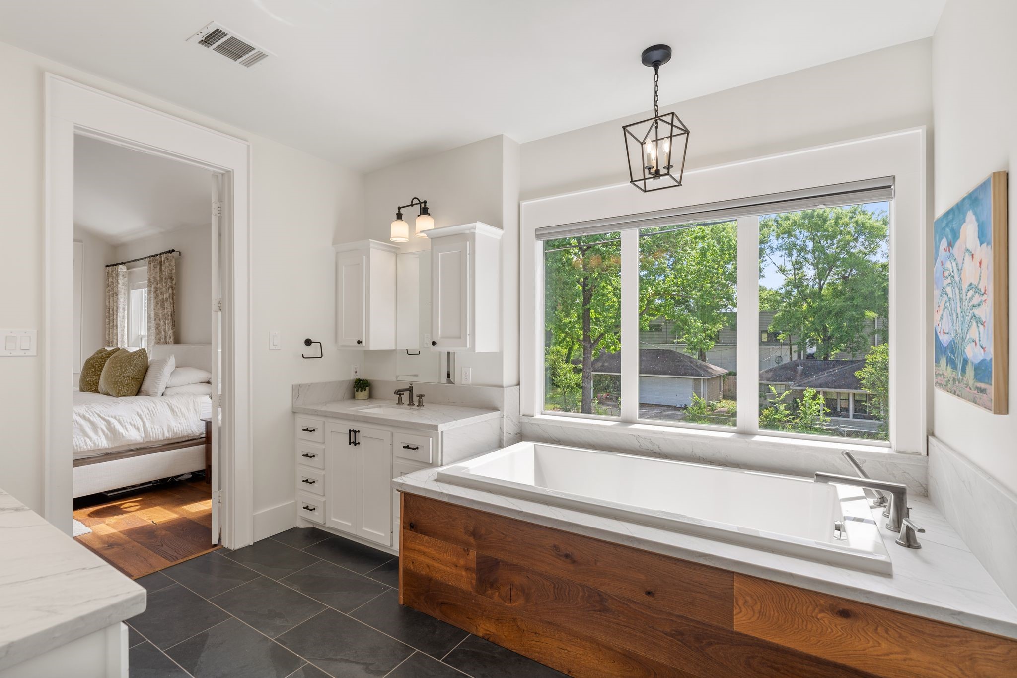 930 West 43rd Street Houston, TX 77018 - Photo 24 of 39 a bathroom with a granite countertop sink and a large mirror