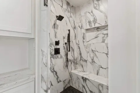 a view of a porch with furniture and a floor to ceiling window