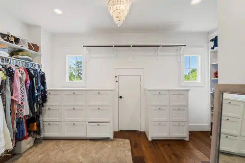 a bedroom with furniture and a window