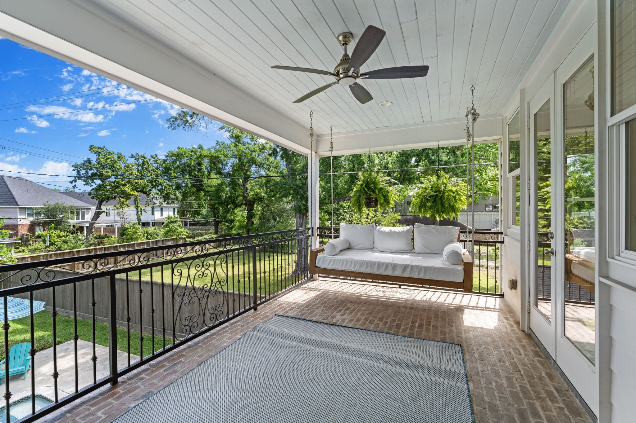 930 West 43rd Street Houston, TX 77018 - Photo 27 of 39 a view of a porch with furniture and a floor to ceiling window
