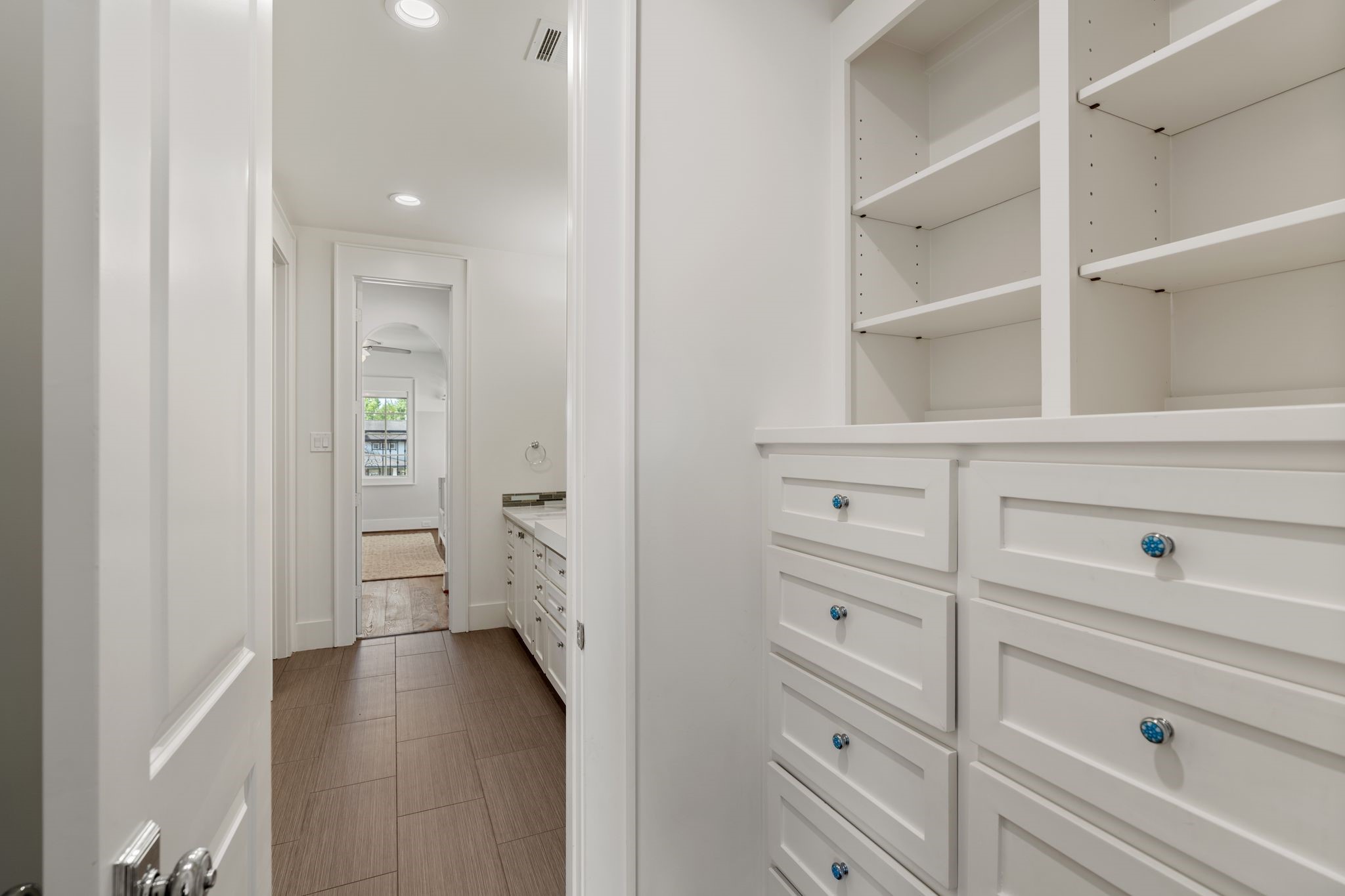 930 West 43rd Street Houston, TX 77018 - Photo 30 of 39 a view of a hallway with closet and wooden floor
