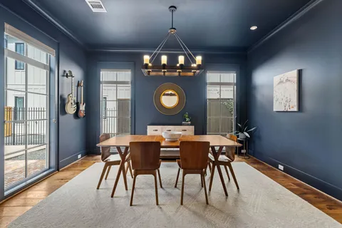 a dining room with furniture and window