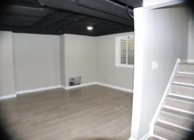 a view of an empty room with stairs