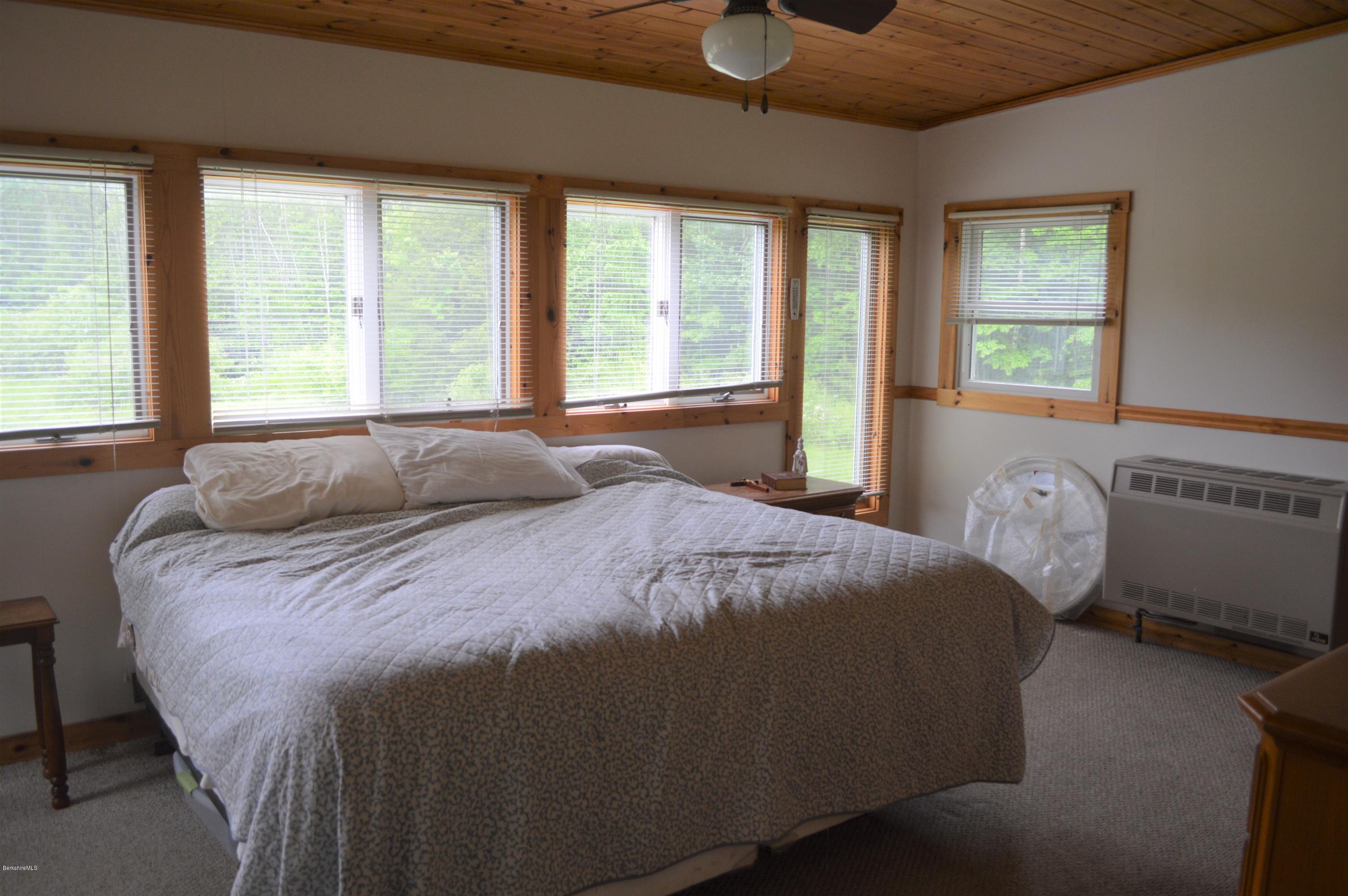 115 Webster Road Tyringham, MA 01264 - Photo 13 of 23 a bedroom with a bed and window