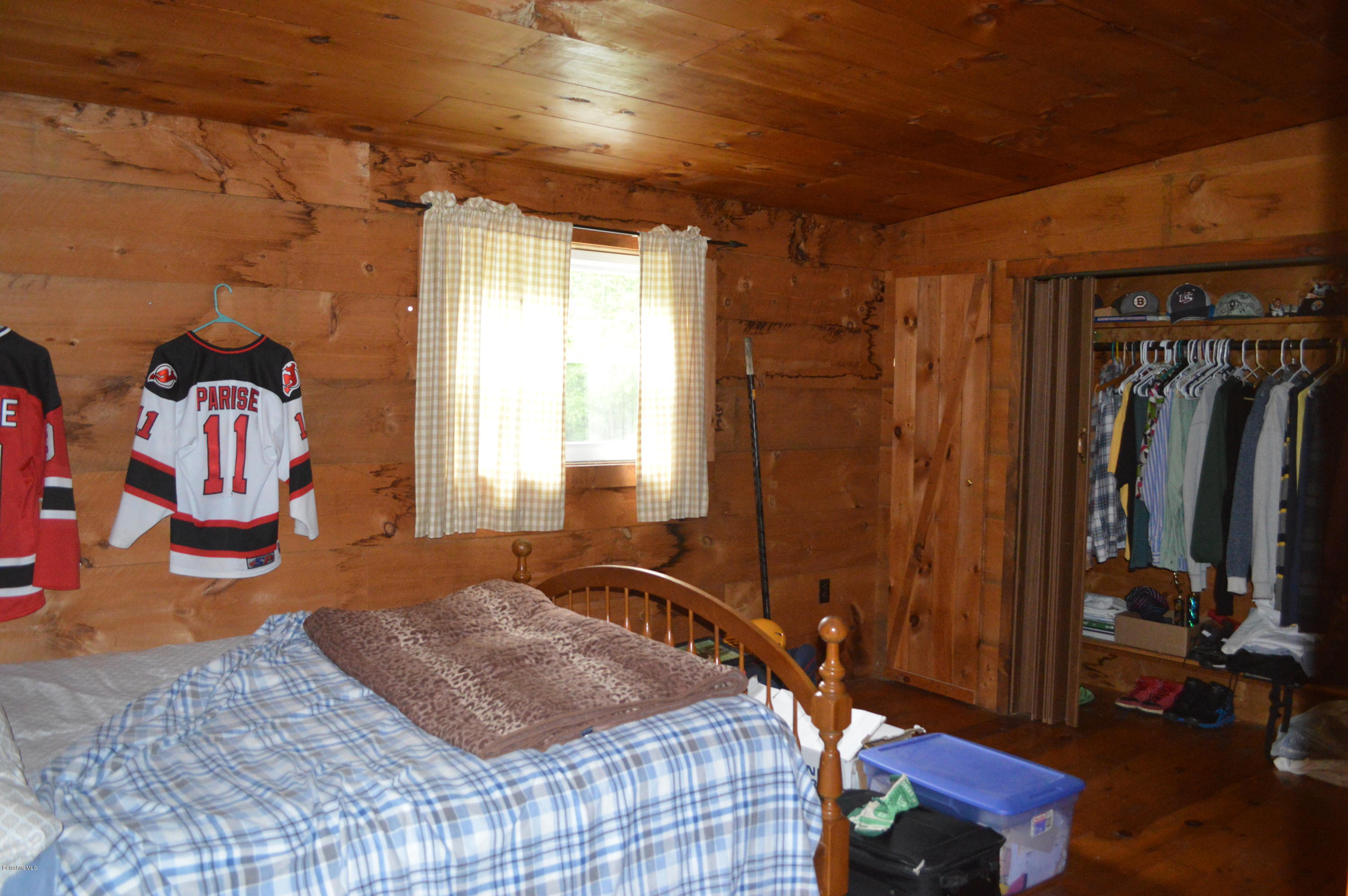 115 Webster Road Tyringham, MA 01264 - Photo 15 of 23 a bedroom with a bed and a window