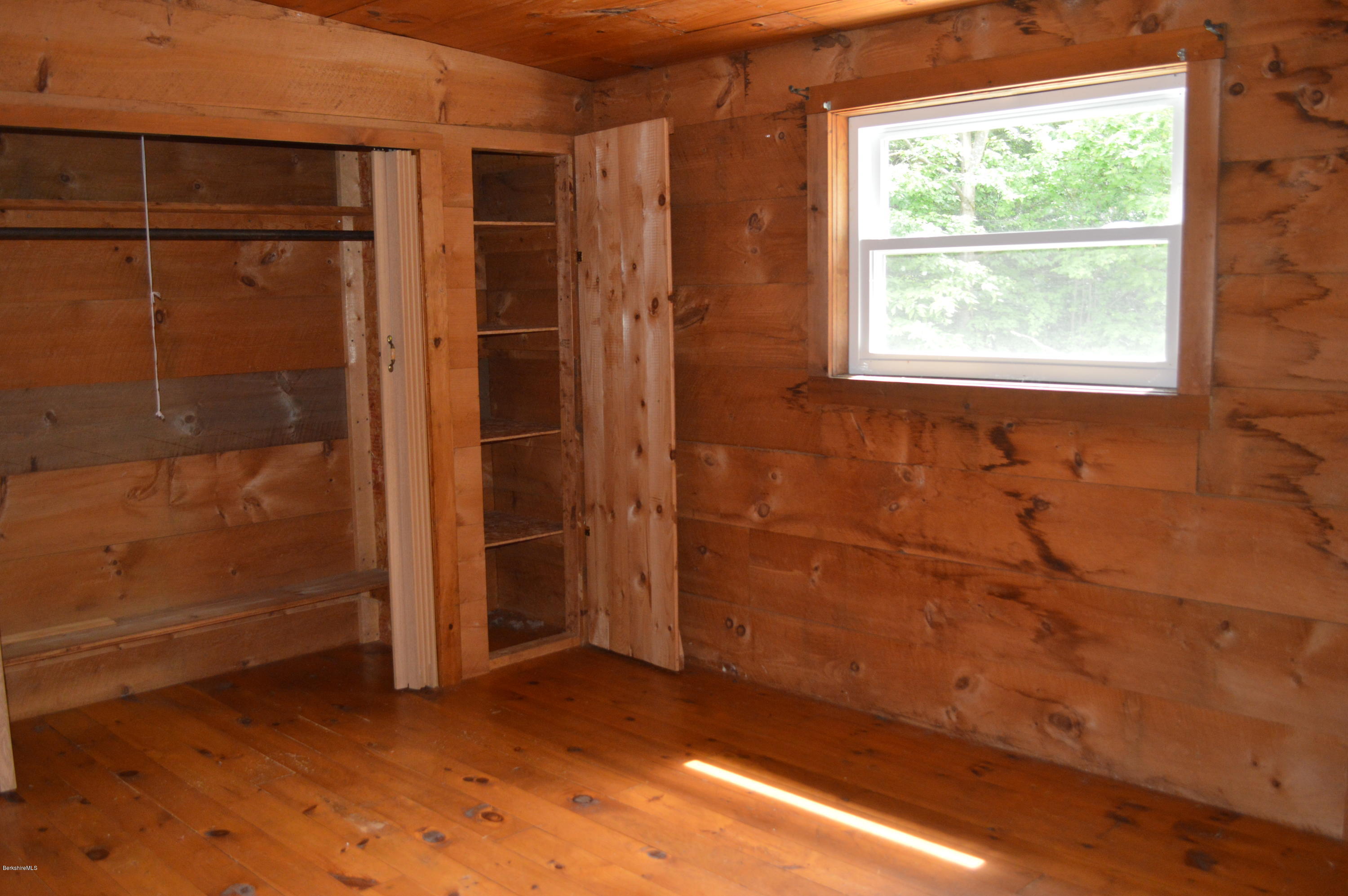 115 Webster Road Tyringham, MA 01264 - Photo 17 of 23 an empty room with a window