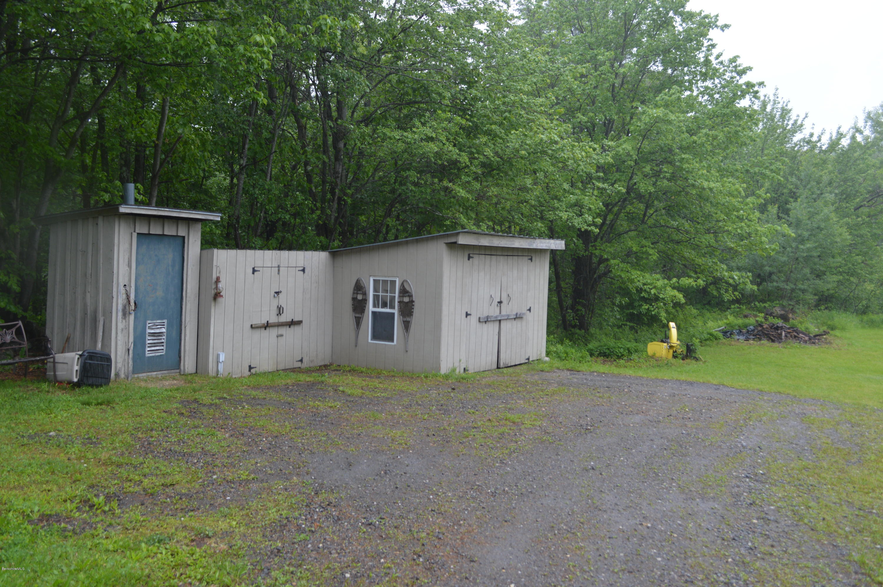 115 Webster Road Tyringham, MA 01264 - Photo 21 of 23 a view of a house with backyard and a tree
