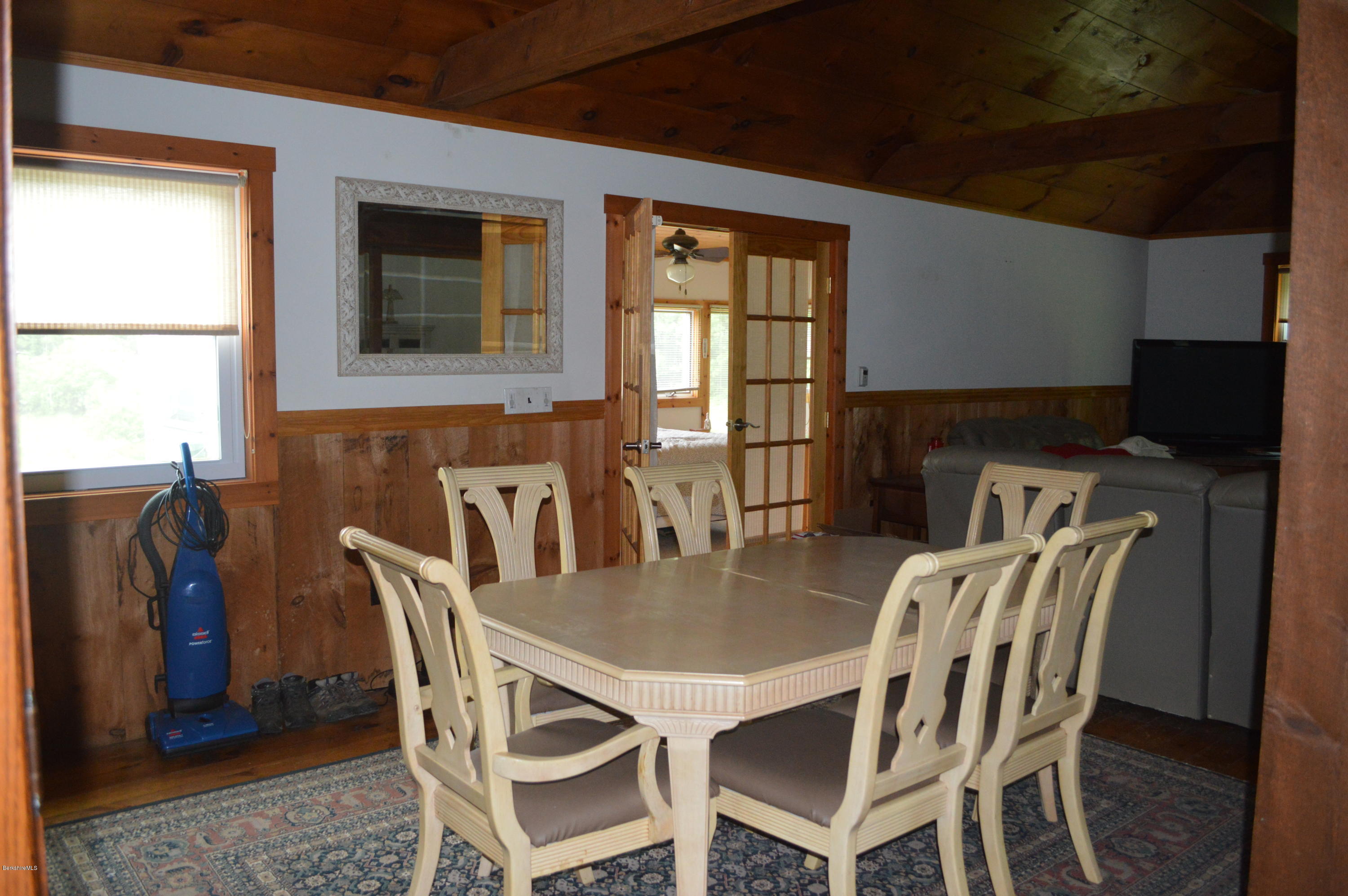 115 Webster Road Tyringham, MA 01264 - Photo 6 of 23 a view of a dining room with furniture and window