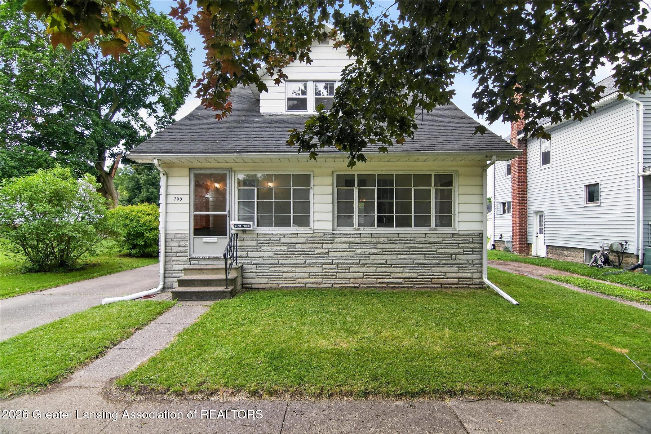 709 Rock Street Jackson, MI 49202 - Photo 3 of 53 03-709-Rock-St-WindowStill