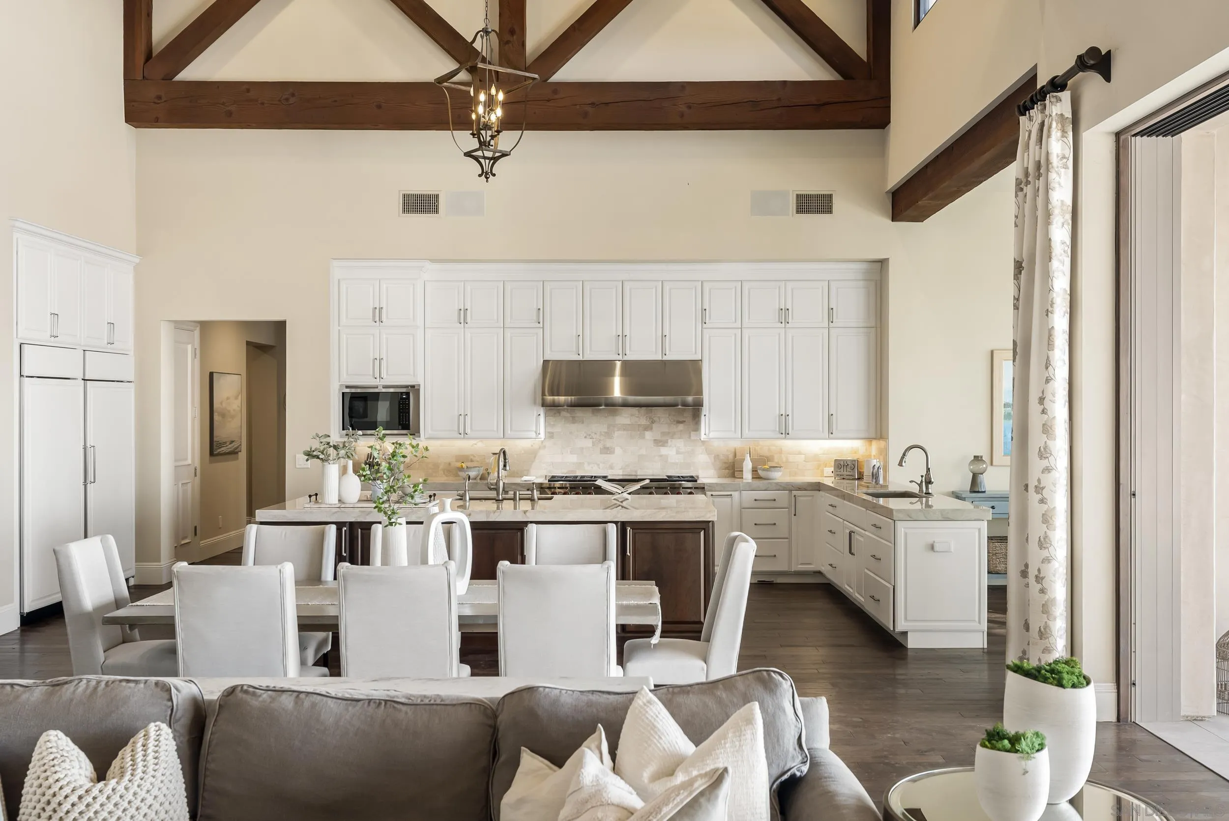 8046 El Cielo Rancho Santa Fe, CA 92067 - Photo 17 of 68 a large kitchen with kitchen island stainless steel appliances a stove a table and chairs