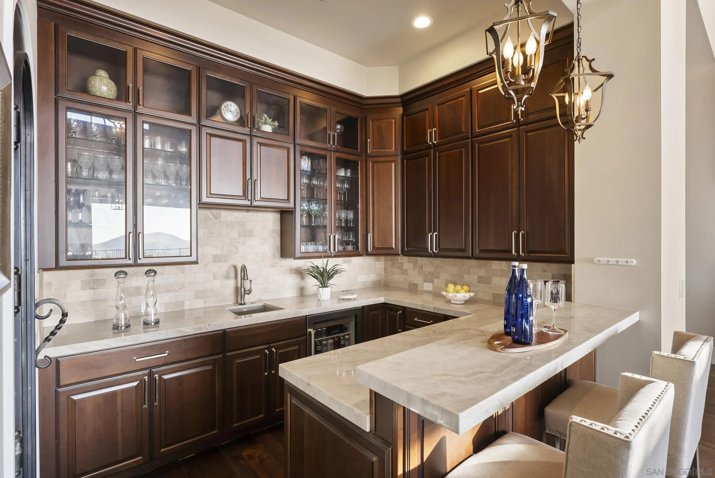 8046 El Cielo Rancho Santa Fe, CA 92067 - Photo 19 of 68 a kitchen with a sink and a refrigerator