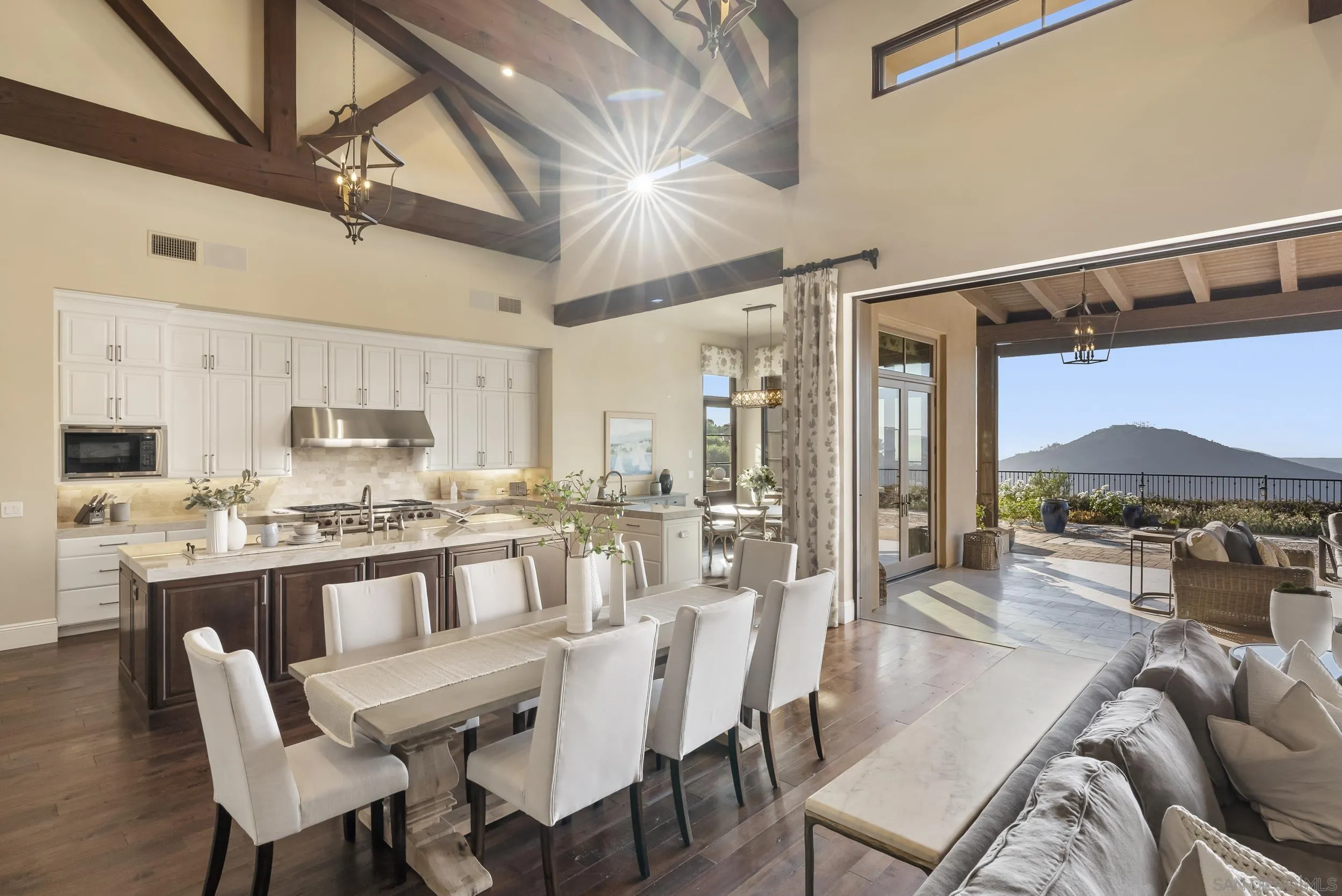 8046 El Cielo Rancho Santa Fe, CA 92067 - Photo 21 of 68 a view of a dining room with furniture window and wooden floor