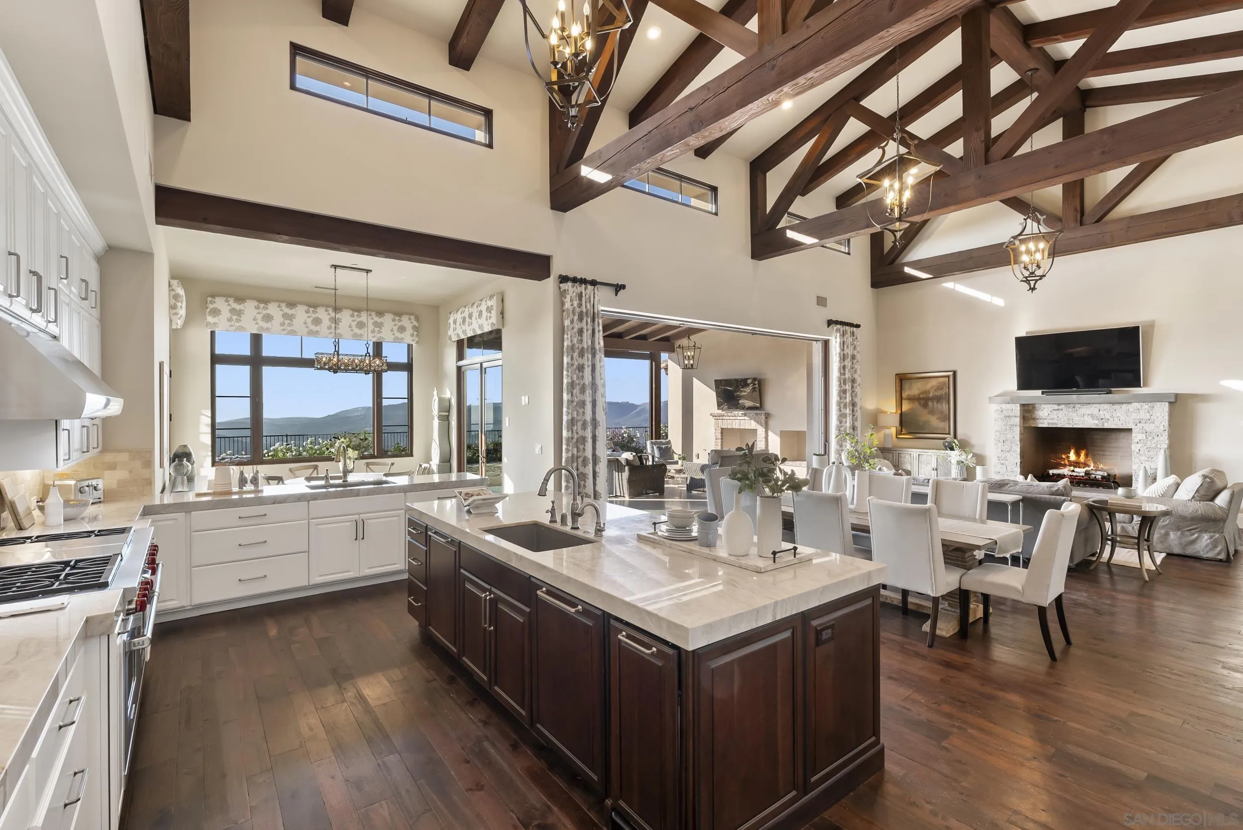 8046 El Cielo Rancho Santa Fe, CA 92067 - Photo 23 of 68 a large white kitchen with a large window and stainless steel appliances