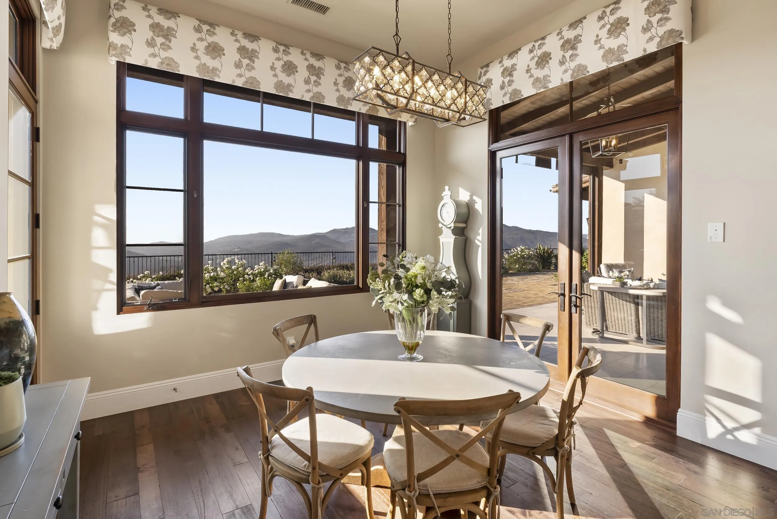 8046 El Cielo Rancho Santa Fe, CA 92067 - Photo 28 of 68 a view of a dining room with furniture window and wooden floor