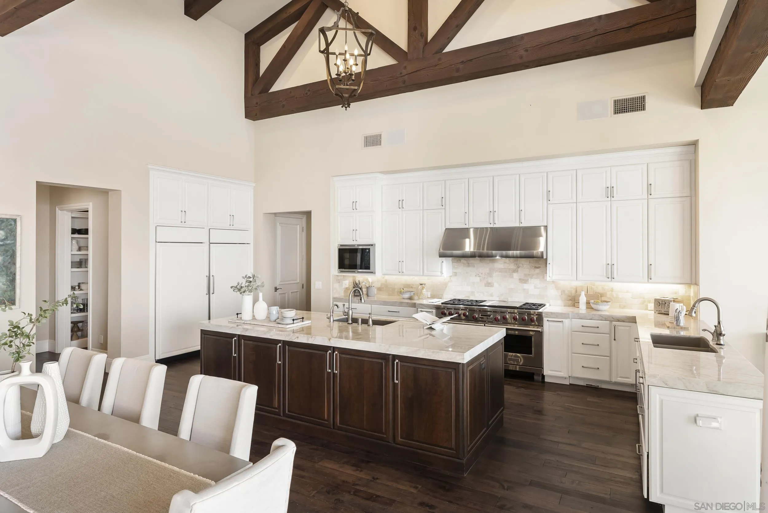 8046 El Cielo Rancho Santa Fe, CA 92067 - Photo 29 of 68 a view of a kitchen with kitchen island a sink stainless steel appliances and cabinets
