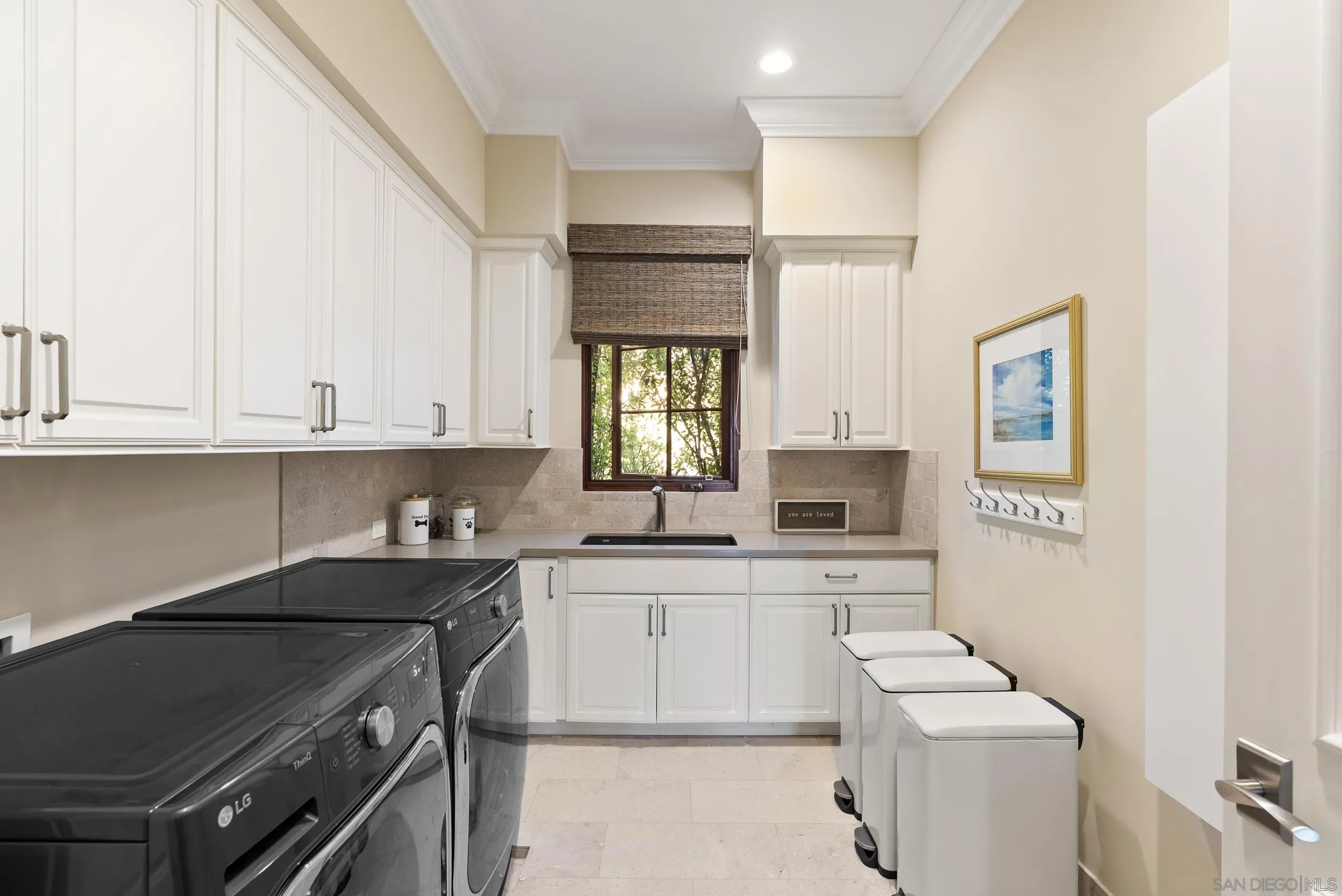 8046 El Cielo Rancho Santa Fe, CA 92067 - Photo 46 of 68 a kitchen with a sink stove and cabinets