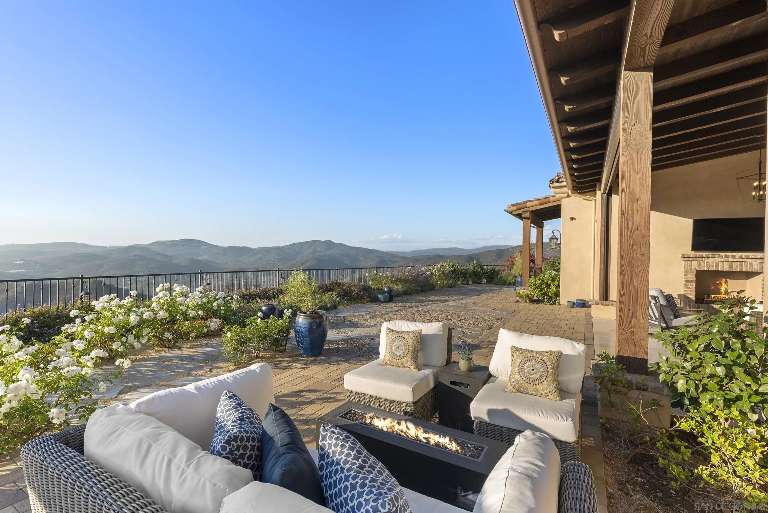 8046 El Cielo Rancho Santa Fe, CA 92067 - Photo 50 of 68 a view of a balcony with couches and wooden floor