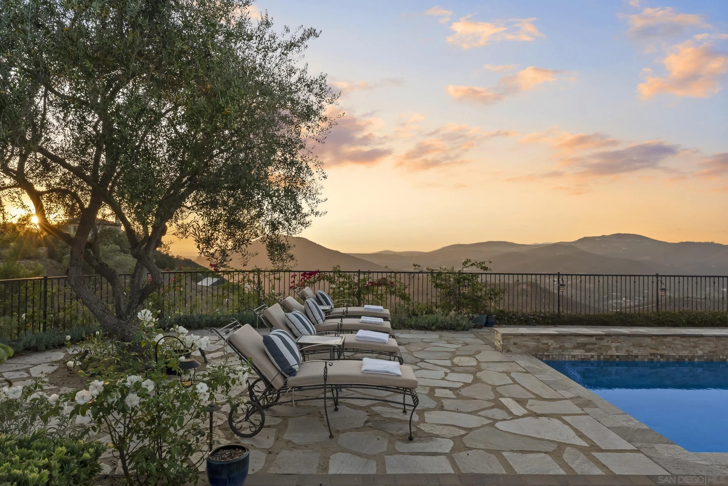 8046 El Cielo Rancho Santa Fe, CA 92067 - Photo 59 of 68 a view of a terrace with a bench and trees
