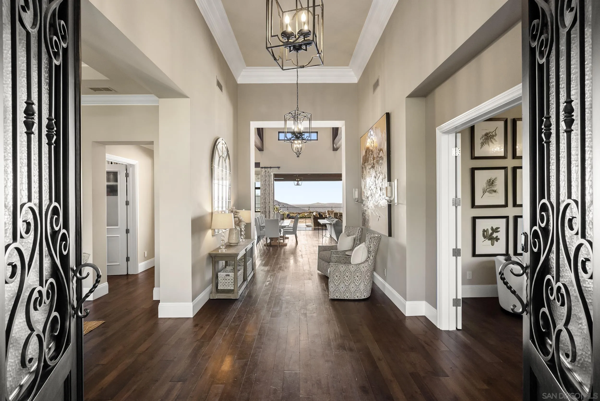 8046 El Cielo Rancho Santa Fe, CA 92067 - Photo 6 of 68 a living room with furniture and a chandelier