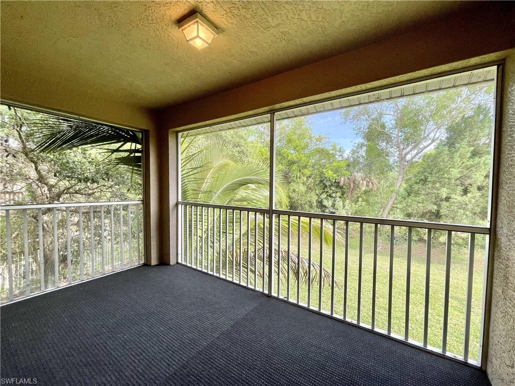 5470 16th Place Southwest, Unit 107 Naples, FL 34116 - Photo 13 of 31 a view of a large window with an outdoor space