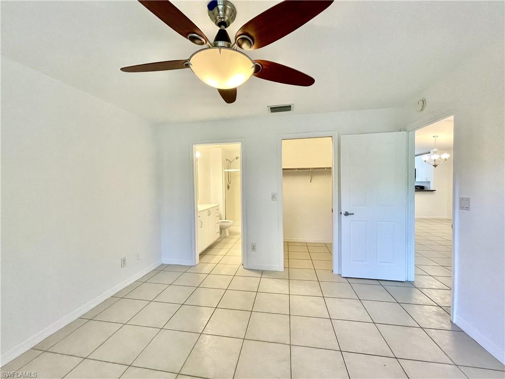 5470 16th Place Southwest, Unit 107 Naples, FL 34116 - Photo 15 of 31 a view of an empty room and window