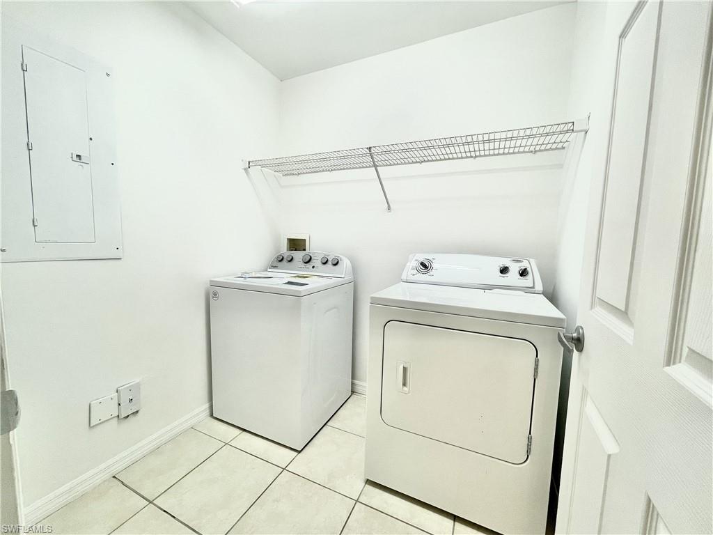 5470 16th Place Southwest, Unit 107 Naples, FL 34116 - Photo 16 of 31 a utility room with dryer and washer