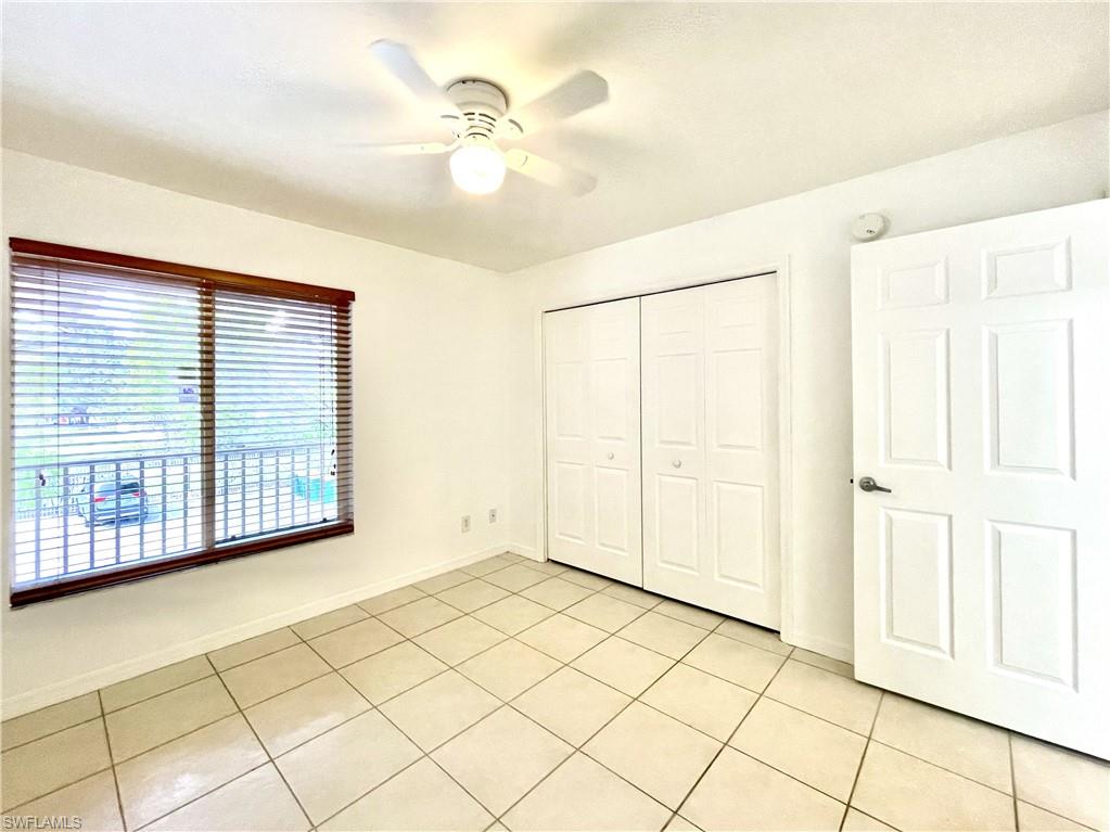 5470 16th Place Southwest, Unit 107 Naples, FL 34116 - Photo 18 of 31 a view of an empty room with a window