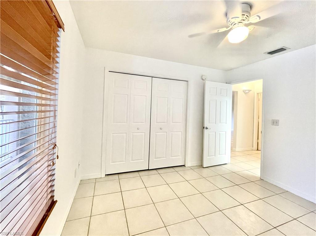 5470 16th Place Southwest, Unit 107 Naples, FL 34116 - Photo 21 of 31 a view of an empty room and window