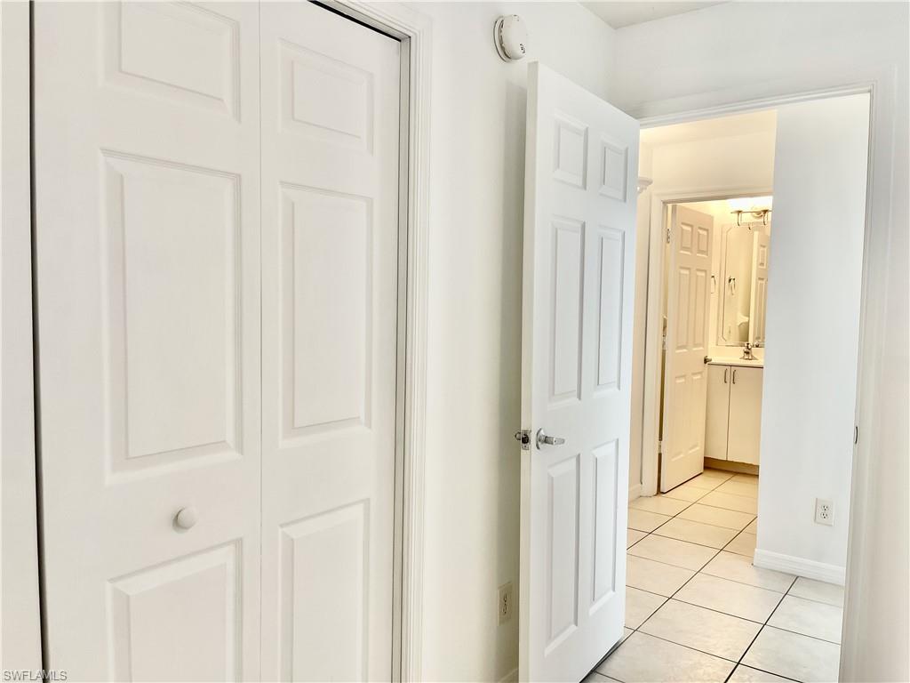 5470 16th Place Southwest, Unit 107 Naples, FL 34116 - Photo 22 of 31 a view of a bathroom with a shower