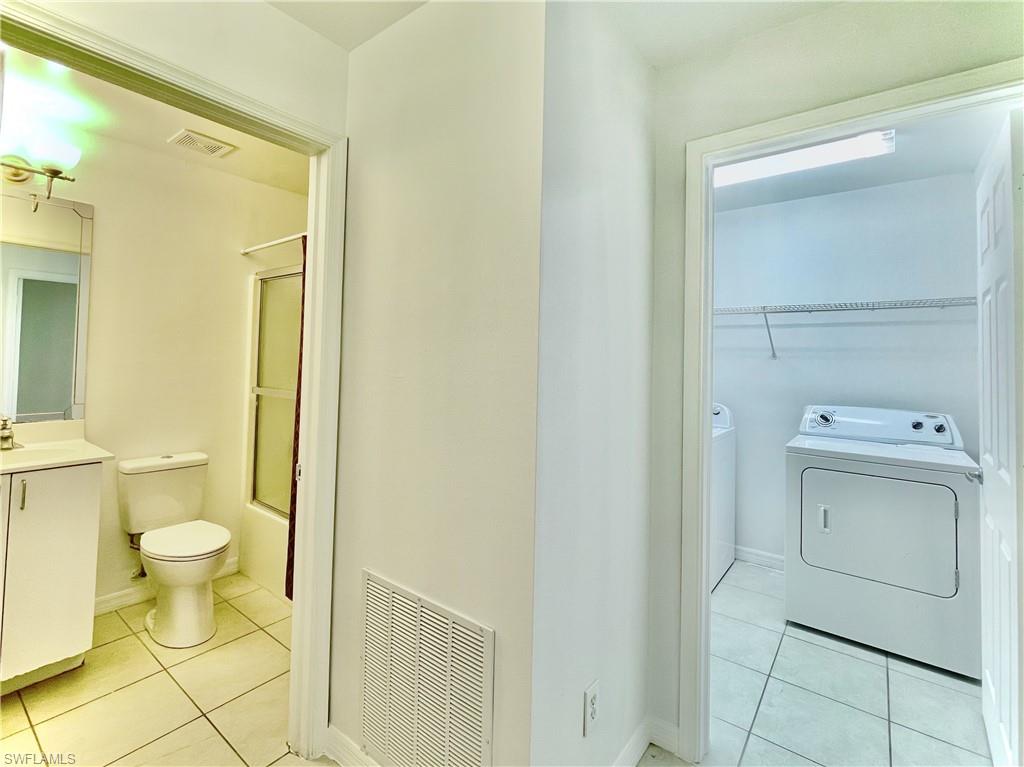 5470 16th Place Southwest, Unit 107 Naples, FL 34116 - Photo 23 of 31 a bathroom with a sink and a toilet