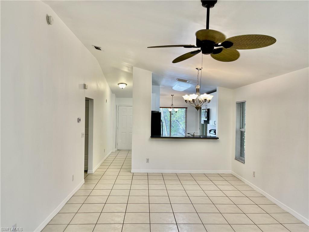 5470 16th Place Southwest, Unit 107 Naples, FL 34116 - Photo 24 of 31 a view of an empty room and window