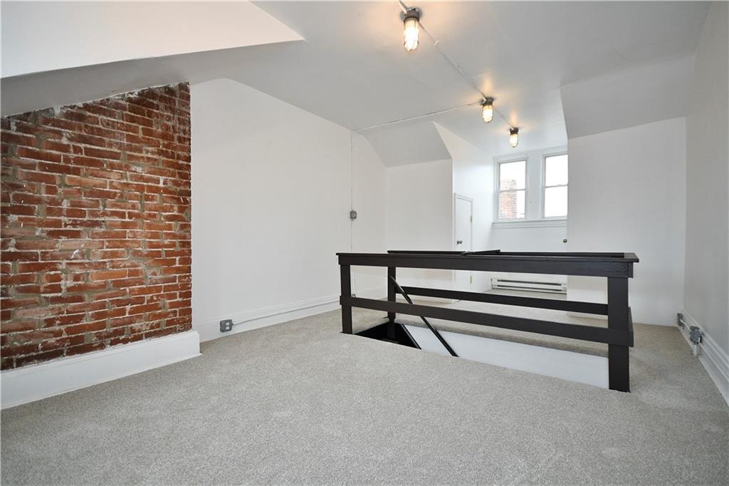 4627 Plummer Street Pittsburgh, PA 15201 - Photo 23 of 29 a view of wooden floor and windows in a room