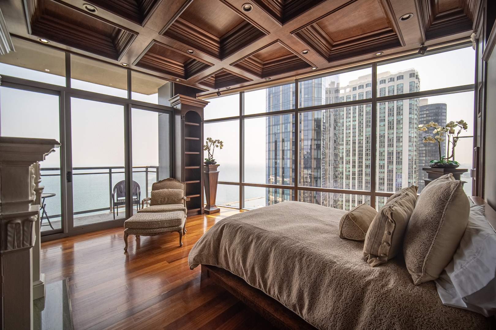 450 East Waterside Drive, Unit 3302 Chicago, IL 60601 - Photo 15 of 52 a bedroom with a bed with wooden floor