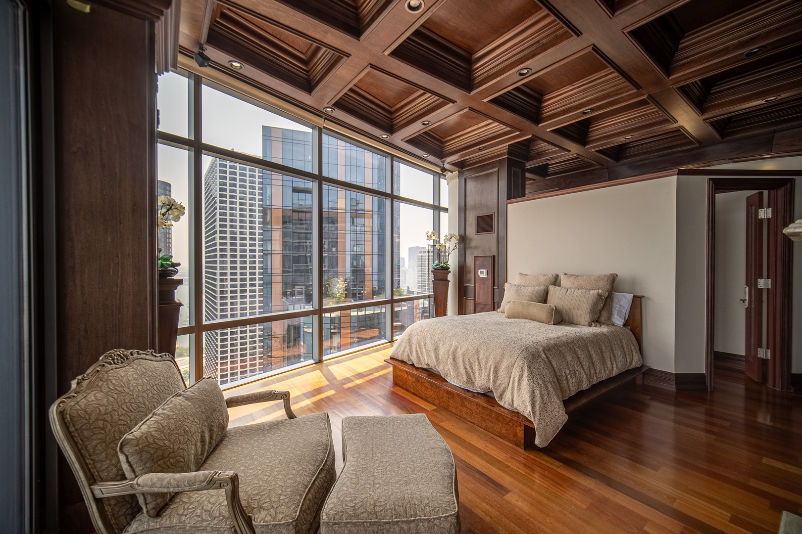 450 East Waterside Drive, Unit 3302 Chicago, IL 60601 - Photo 16 of 52 a bedroom with a bed and wooden floor