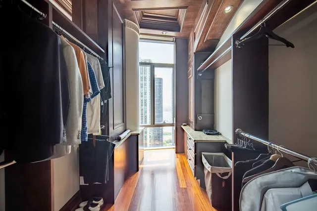 a bathroom with a granite countertop sink a toilet and a mirror