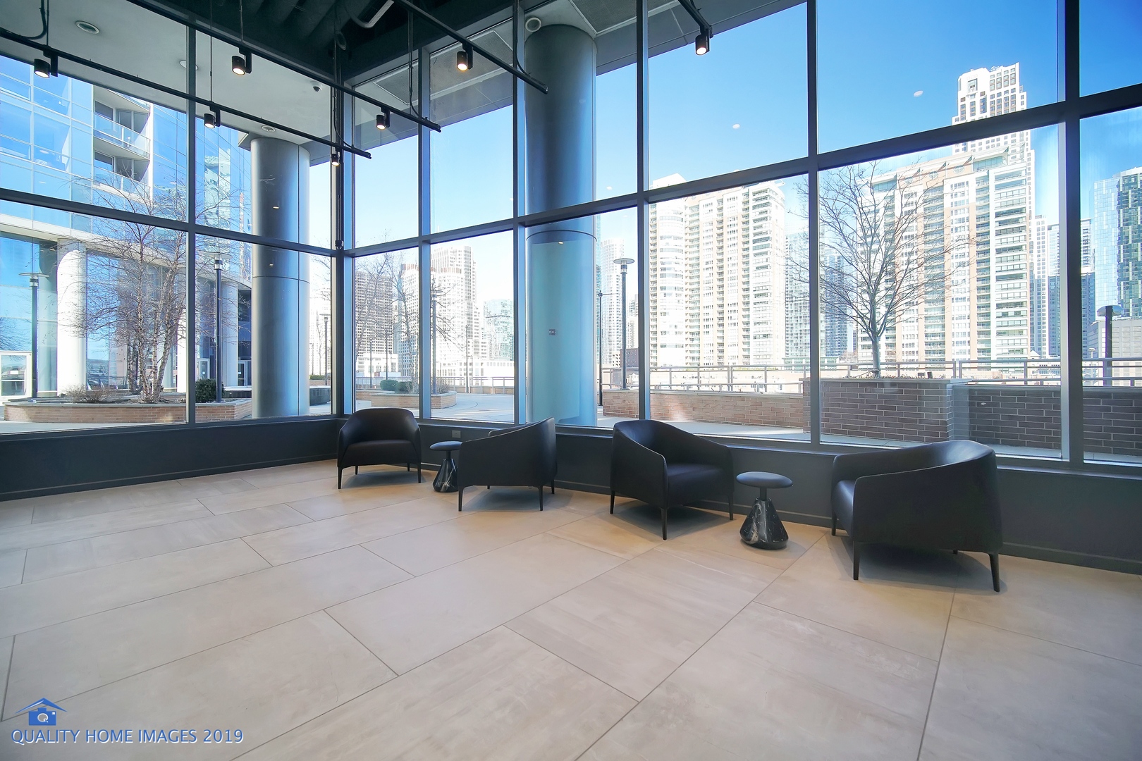 450 East Waterside Drive, Unit 3302 Chicago, IL 60601 - Photo 43 of 52 a living room with furniture and large windows
