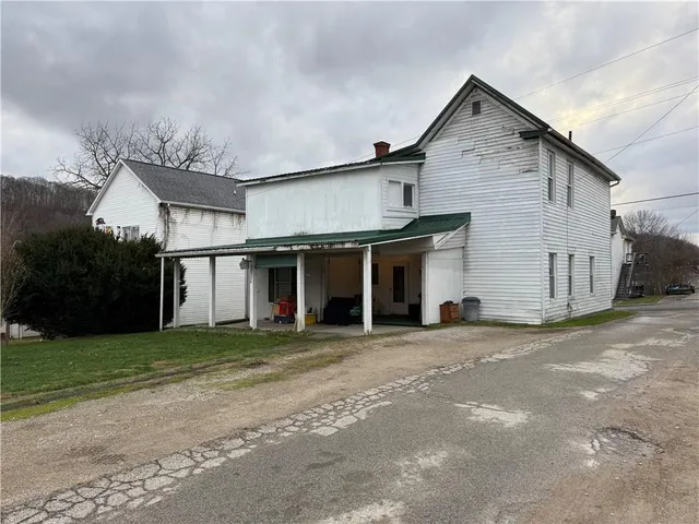 a front view of a house with a garage