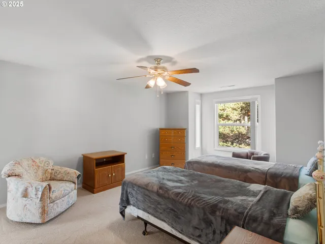 a bedroom with bed and window