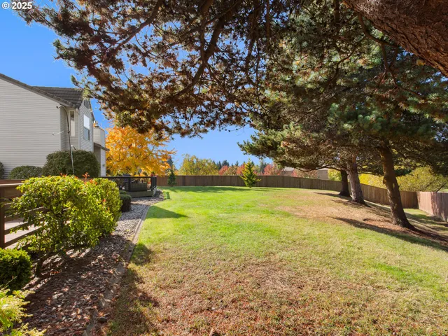 a view of a yard with swimming pool