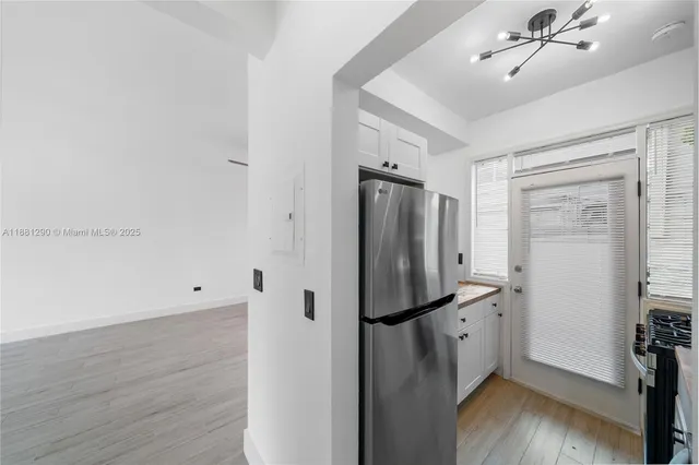 a view of a storage & utility room with wooden floor