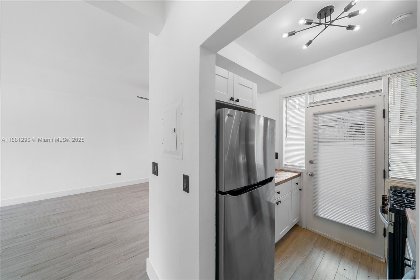 4710 Pine Tree Drive, Unit 31 Miami Beach, FL 33140 - Photo 20 of 25 a view of a storage & utility room with wooden floor