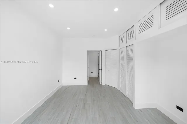 a view of room with wooden floor and window