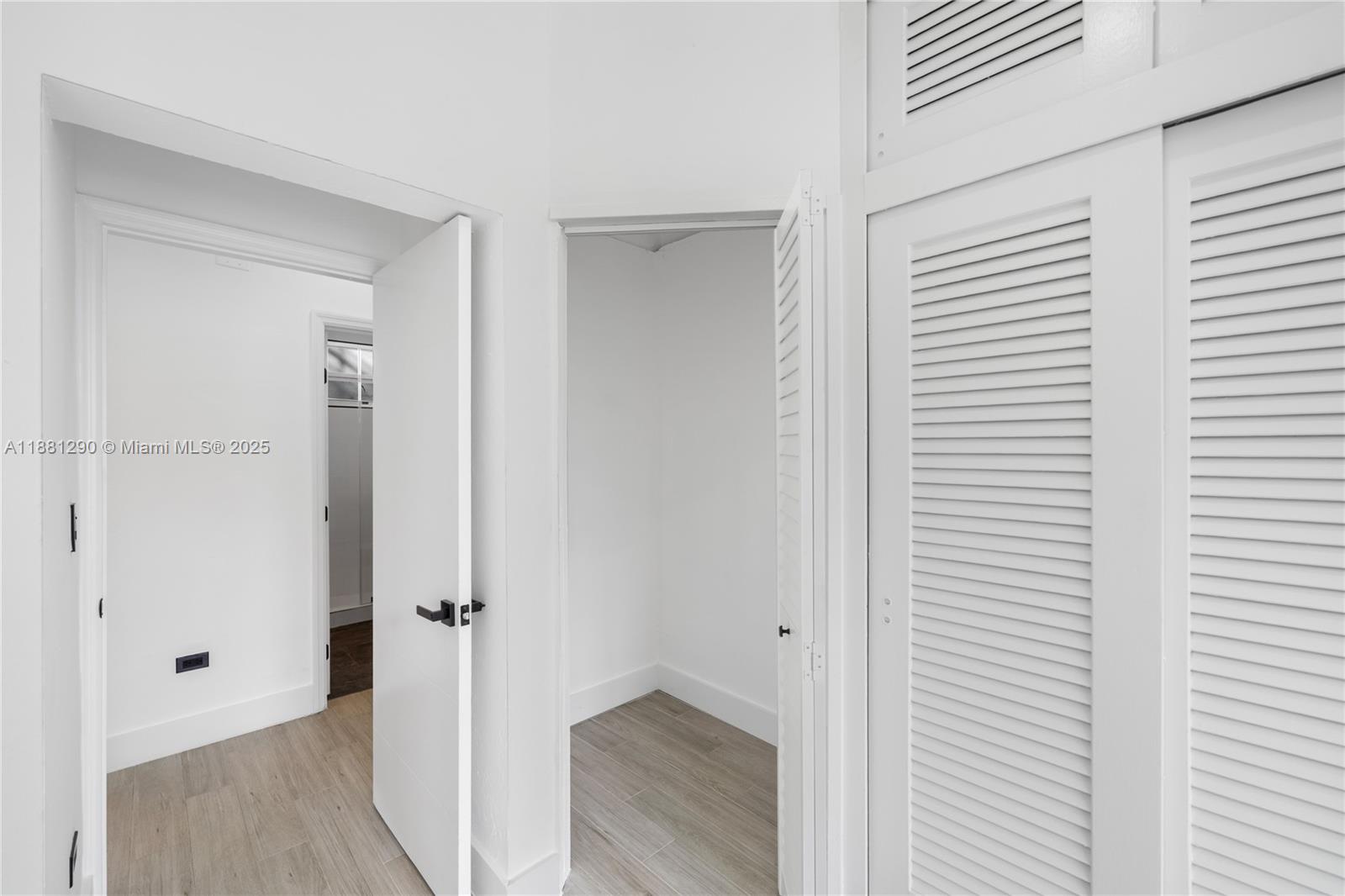4710 Pine Tree Drive, Unit 31 Miami Beach, FL 33140 - Photo 25 of 25 a view of a hallway with wooden floor