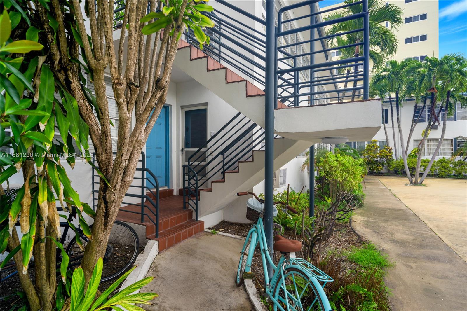 4710 Pine Tree Drive, Unit 31 Miami Beach, FL 33140 - Photo 3 of 25 a backyard of a house with lots of green space