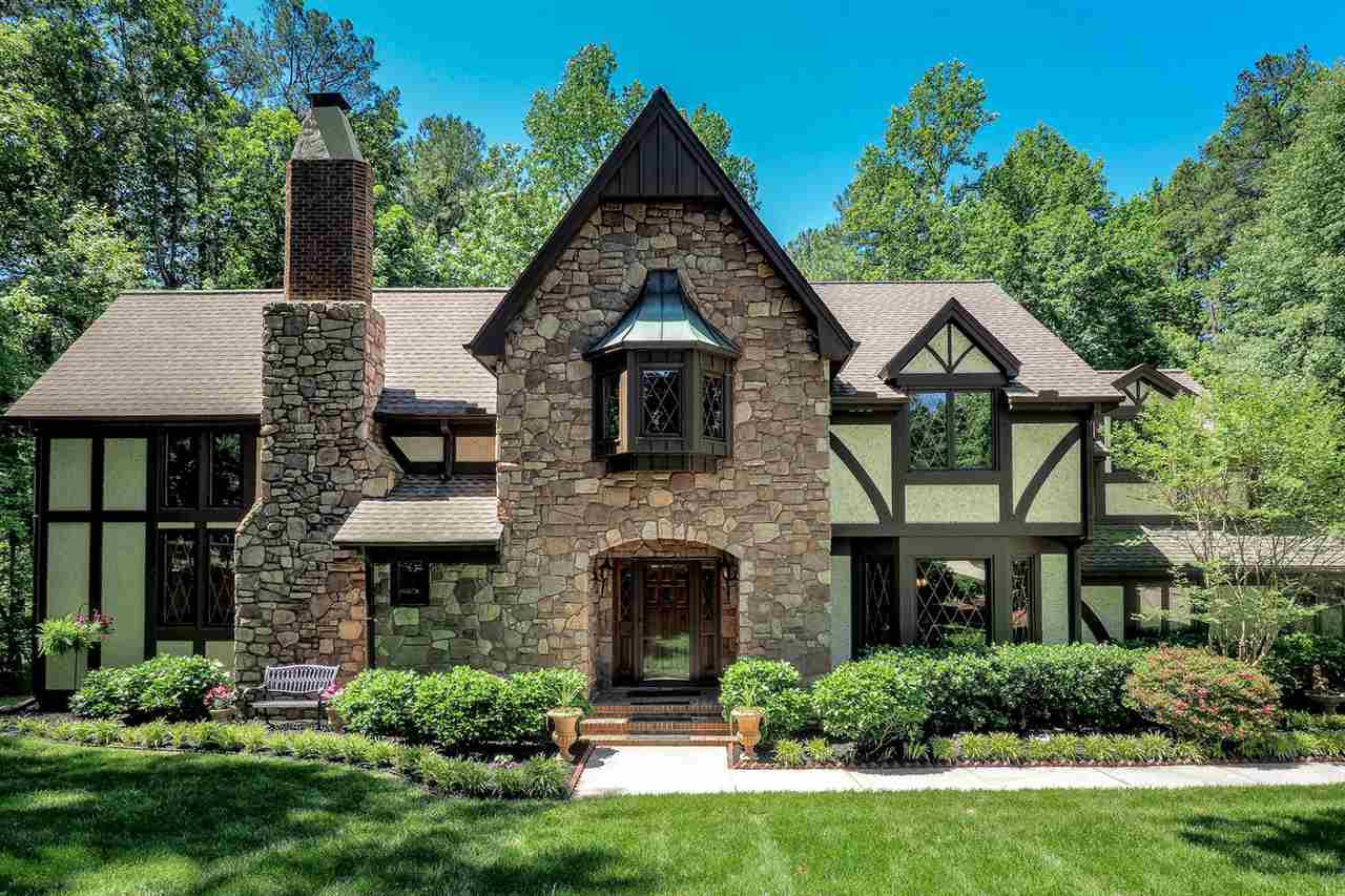 5009 Field And Stream Road Raleigh, NC 27613 - Photo 1 of 12 Exquisite TUDOR style with immaculate detailed craftsmanship nested in the heart of the city. Exterior Front