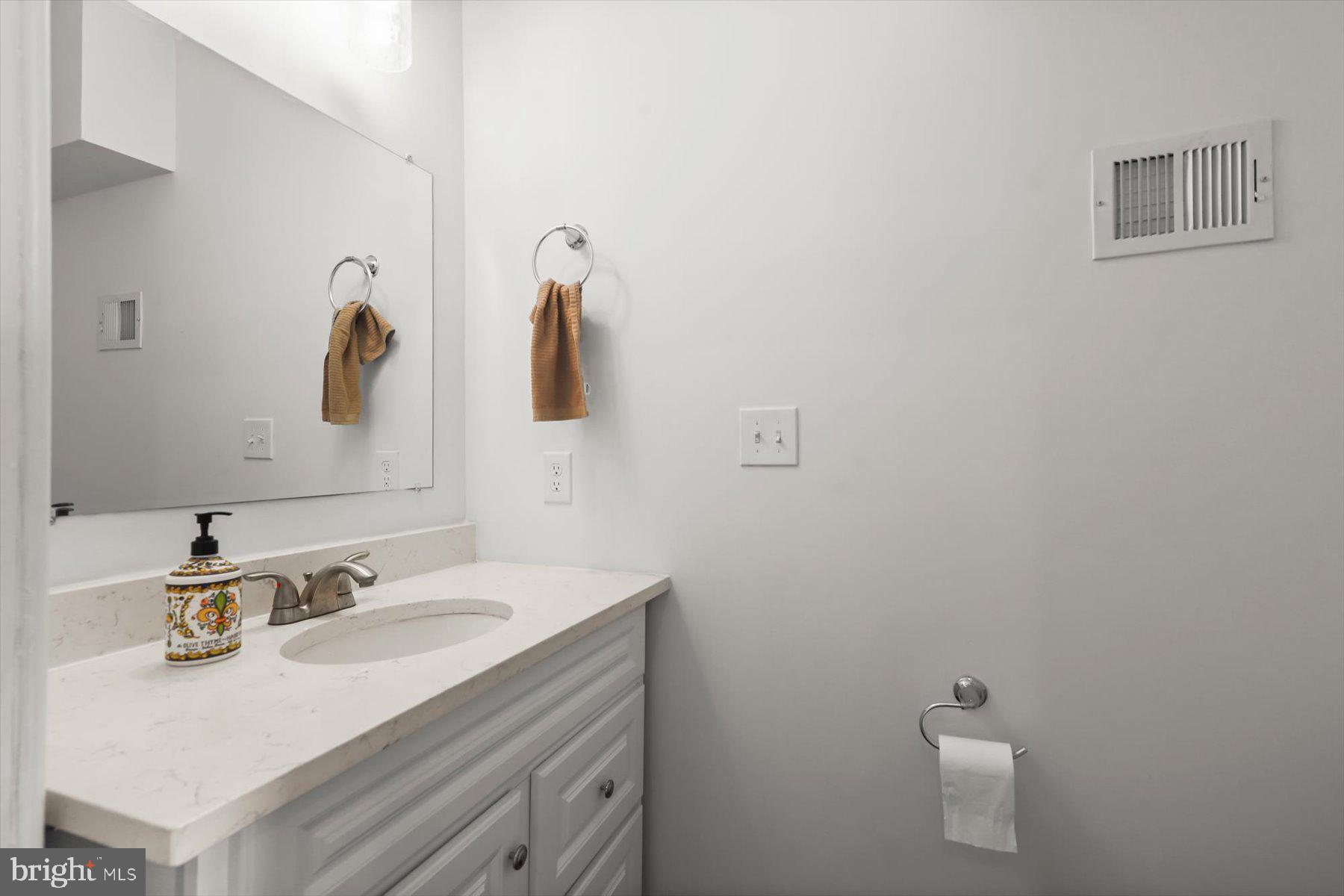 14 East Read Street Baltimore, MD 21202 - Photo 15 of 61 a bathroom with a sink and a toilet