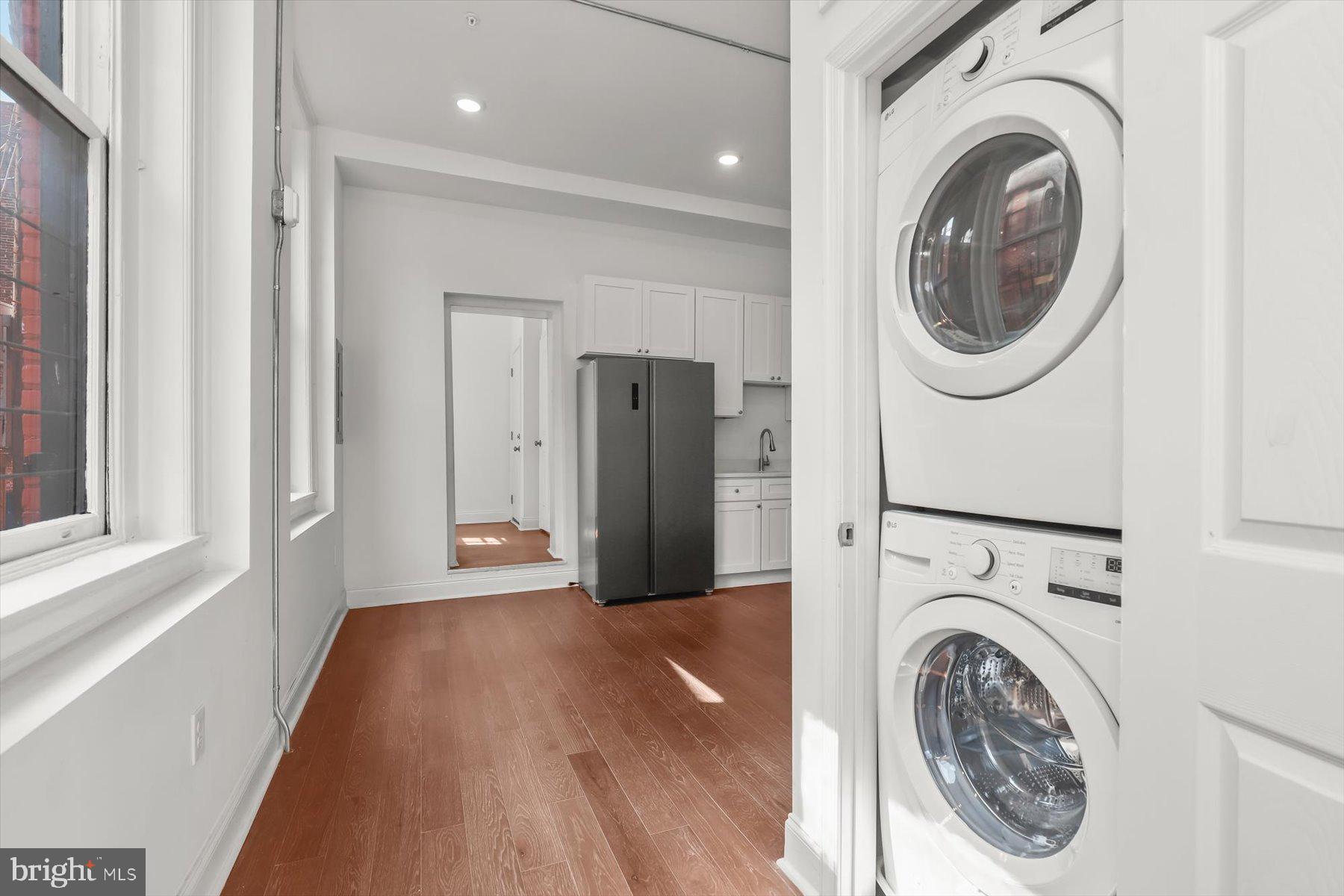 14 East Read Street Baltimore, MD 21202 - Photo 20 of 61 a view of a hallway with washer and dryer