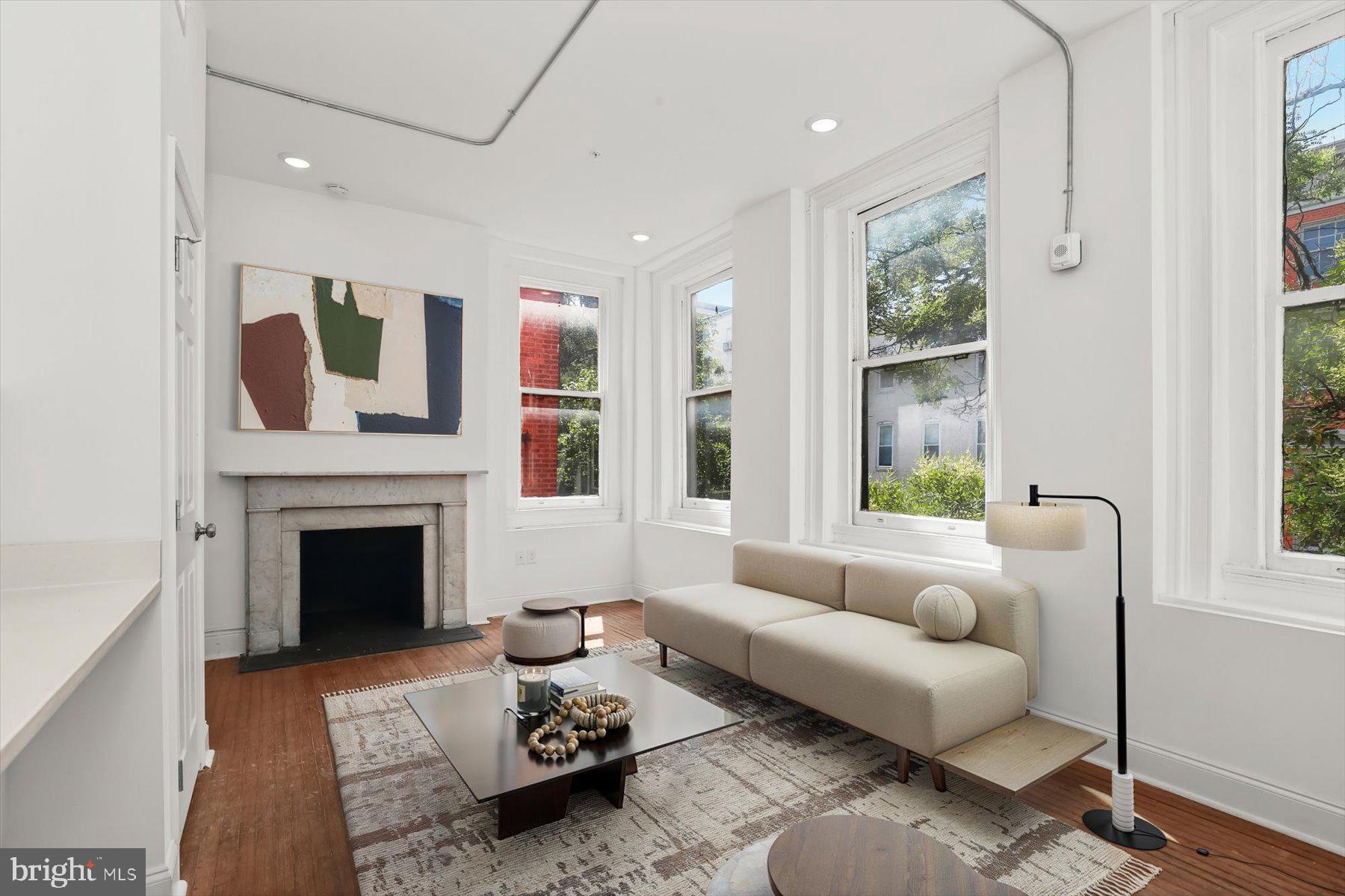 14 East Read Street Baltimore, MD 21202 - Photo 27 of 61 a living room with furniture and a fireplace