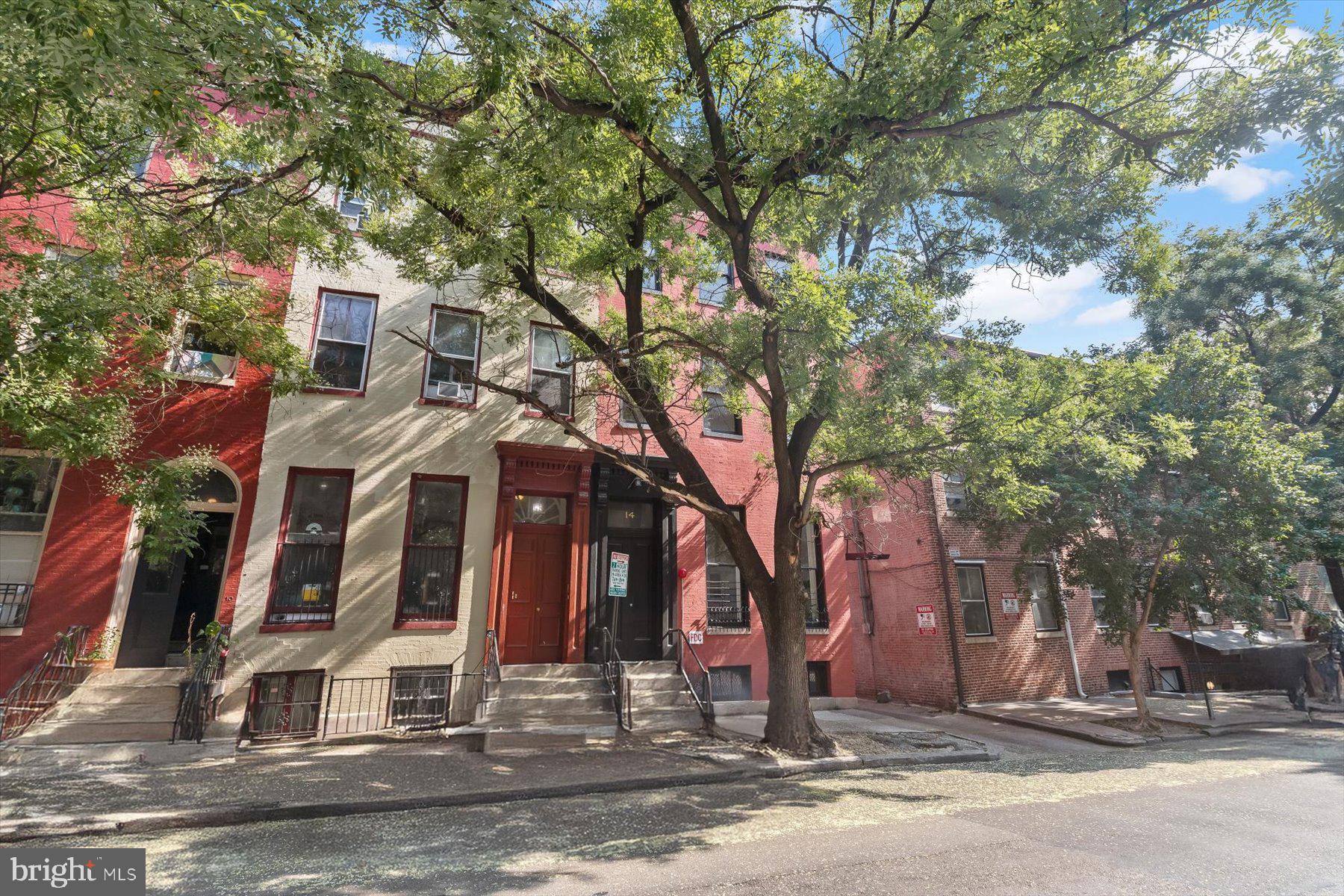 14 East Read Street Baltimore, MD 21202 - Photo 3 of 61 a view of a white house with a tree