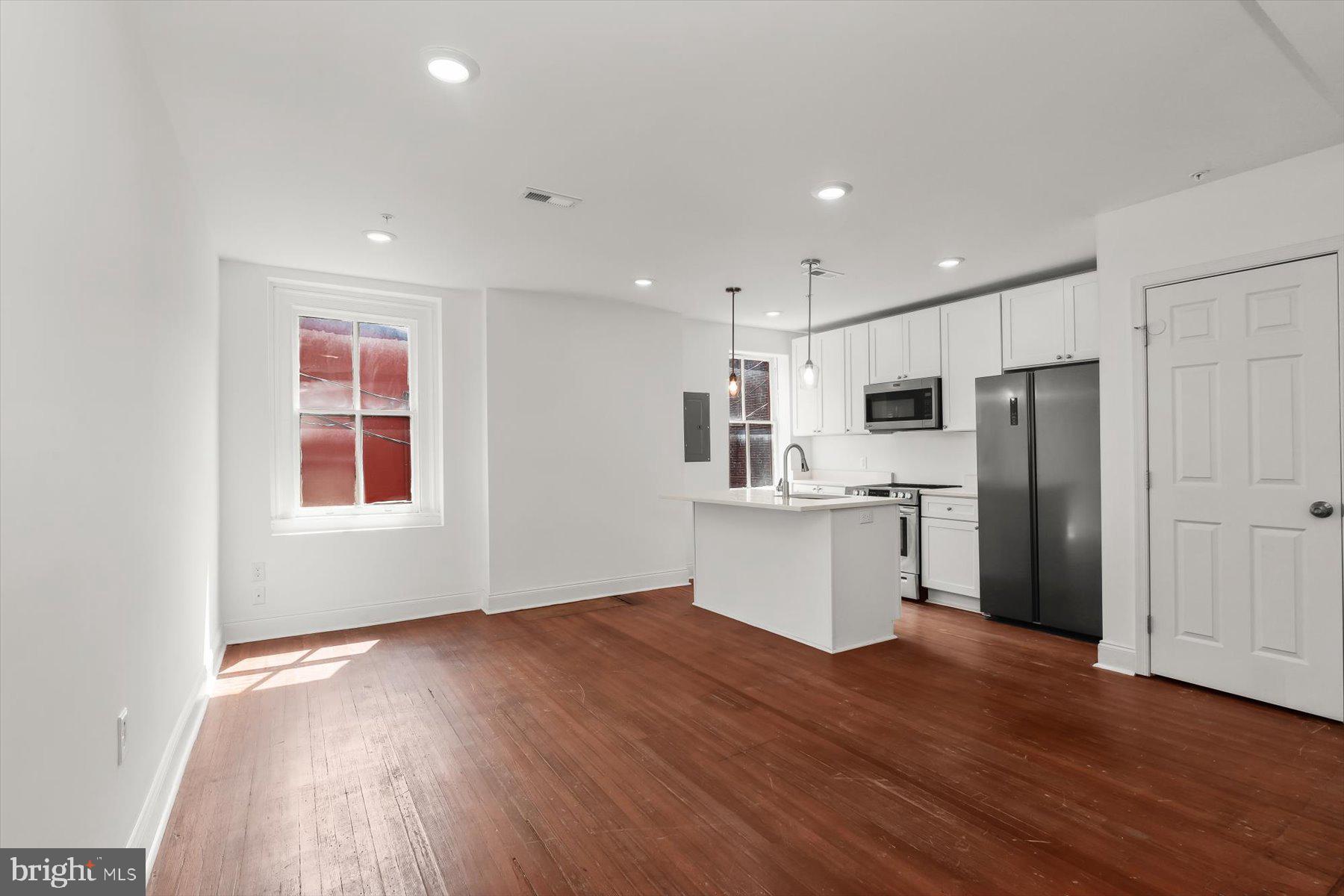 14 East Read Street Baltimore, MD 21202 - Photo 32 of 61 a view of kitchen with wooden floor and electronic appliances